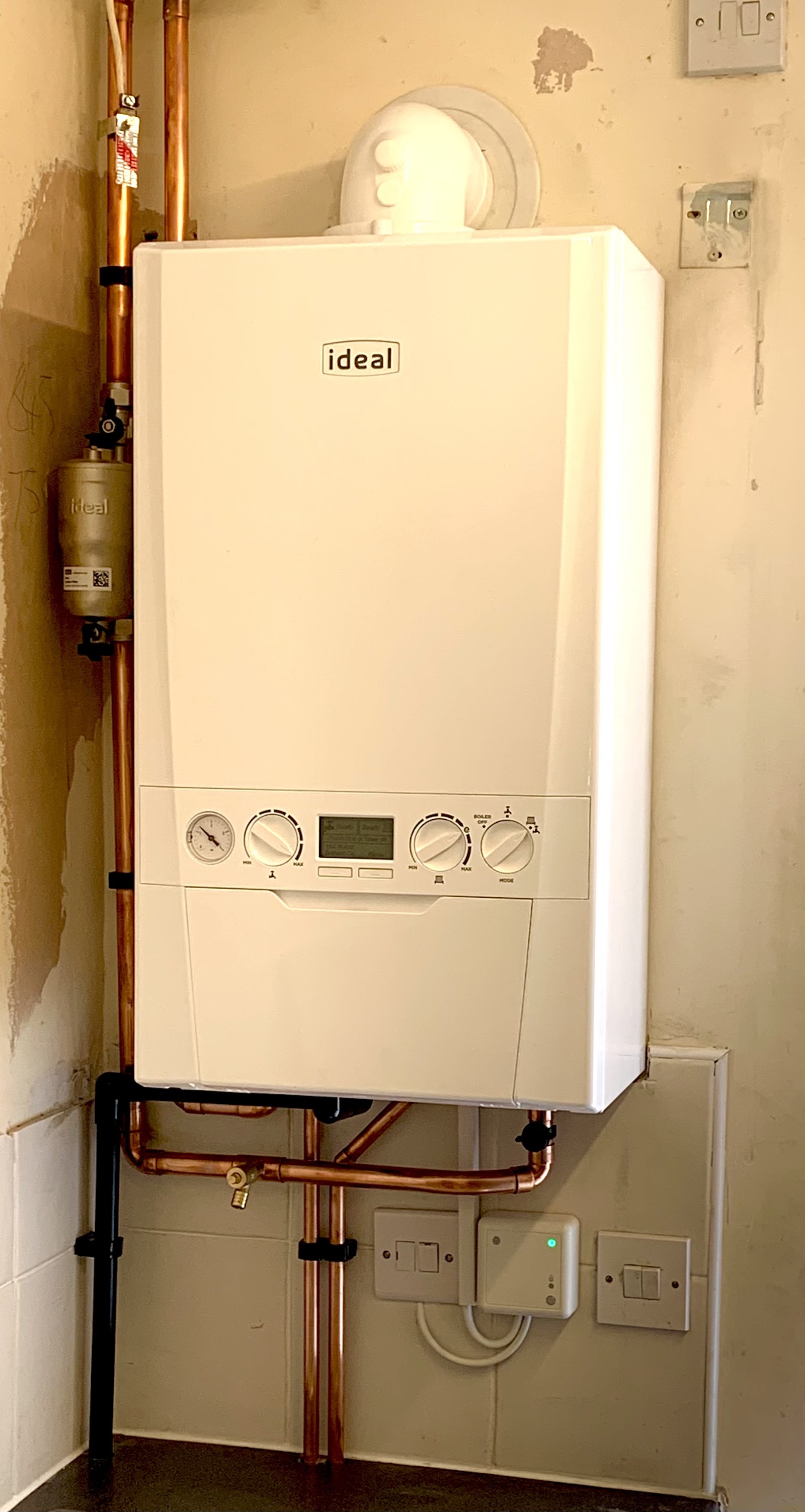 A finished Ideal combi boiler installation with copper pipework